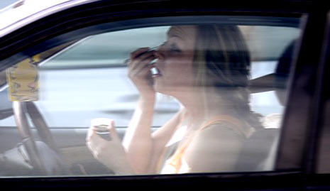 putting on makeup while driving putting on makeup in the car