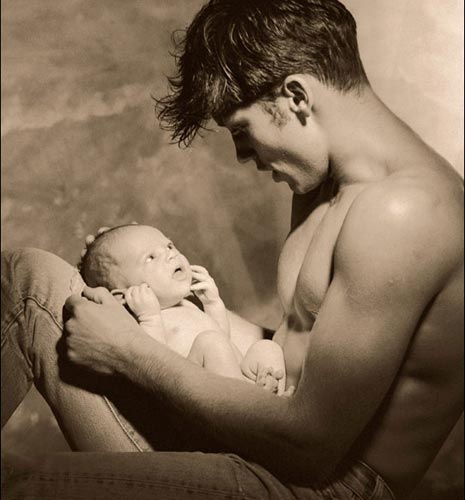 man holding baby photo