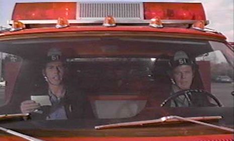 squad 51 emergency ambulance at intersection, red light green light